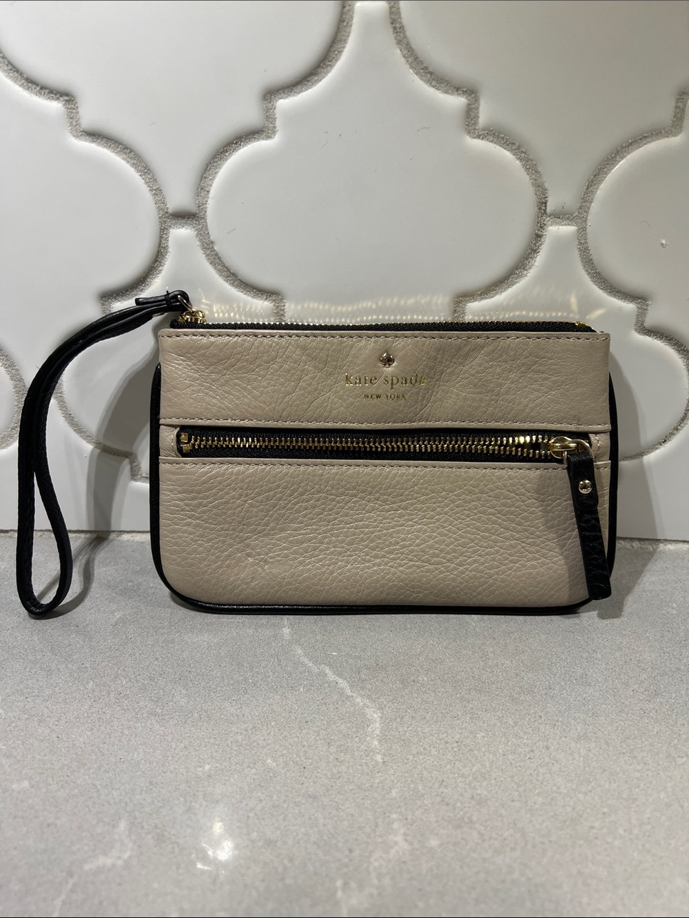 kate spade Pebbled Leather Wristlet in Light Taupe with Black Trim
